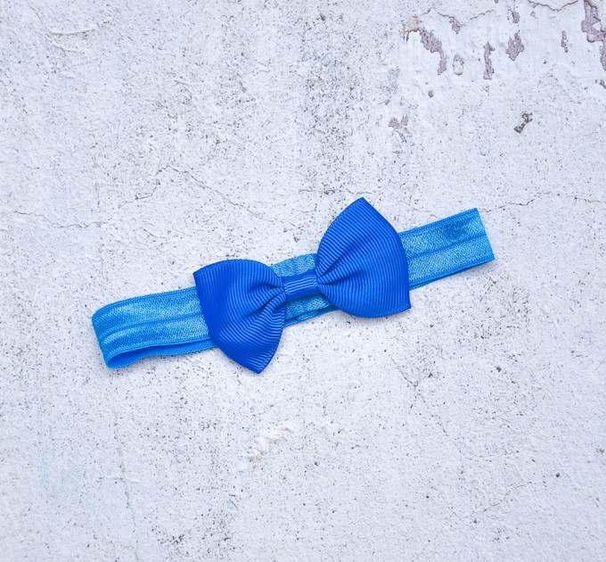 Blythe royal blue elasticized headband  with decorative bow